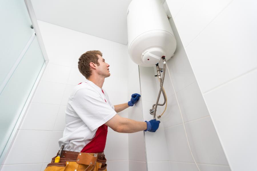 Plumber repairing a water heater